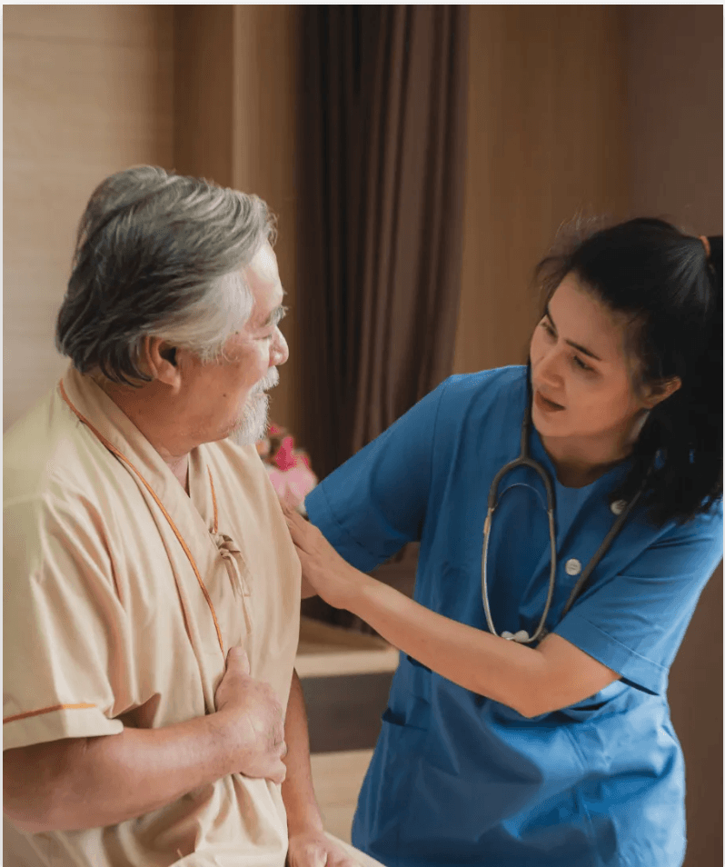 Nurse assisting elderly patient